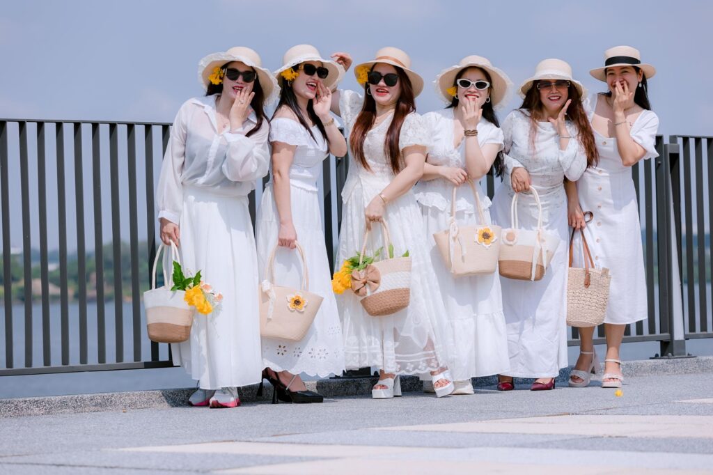 A stylish bachelorette party group posing with themed accessories on the Strip. — bachelorette party in Las Vegas