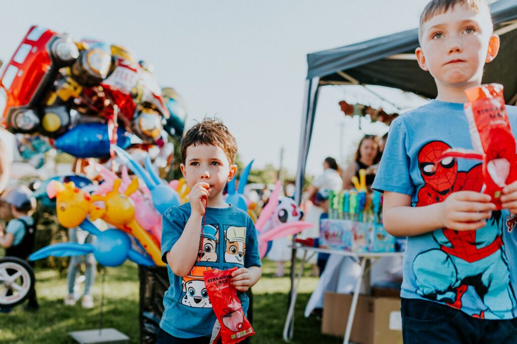 A vibrant summer festival in Las Vegas with food stalls and activities for children. — family activities Las Vegas