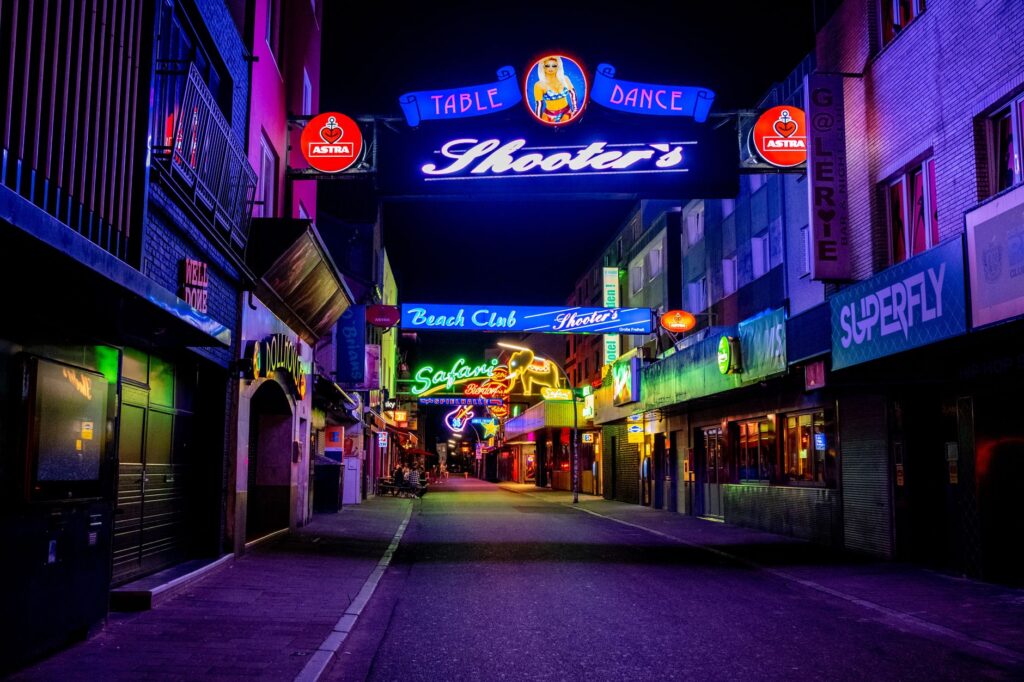 A vibrant view of The Strip at night showcasing various bars and clubs. — Las Vegas nightlife