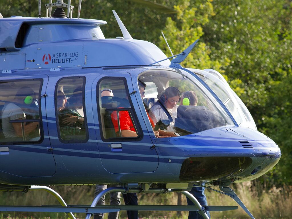 An adventurous group taking a helicopter tour over the Las Vegas landscape. — Vegas bachelor bachelorette party planning