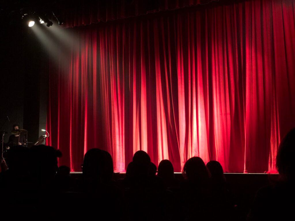 An audience laughing during a comedy show in Las Vegas. — budget-friendly shows Las Vegas