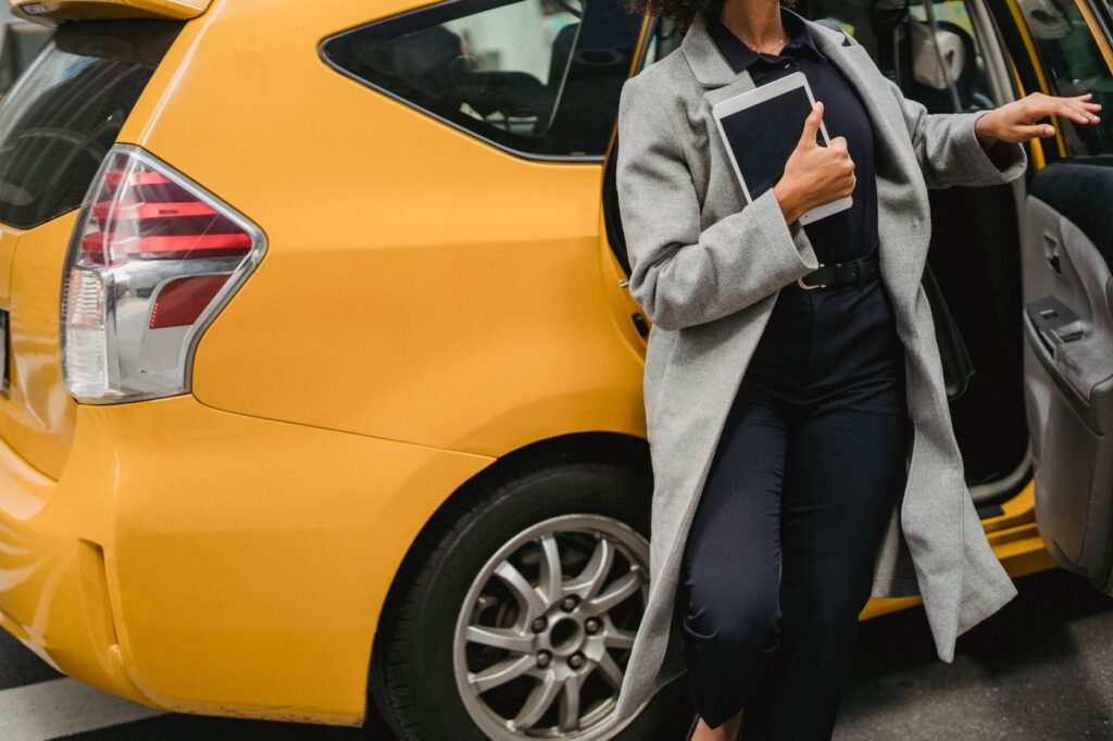 An image of a ride-sharing vehicle picking up passengers — getting around las vegas