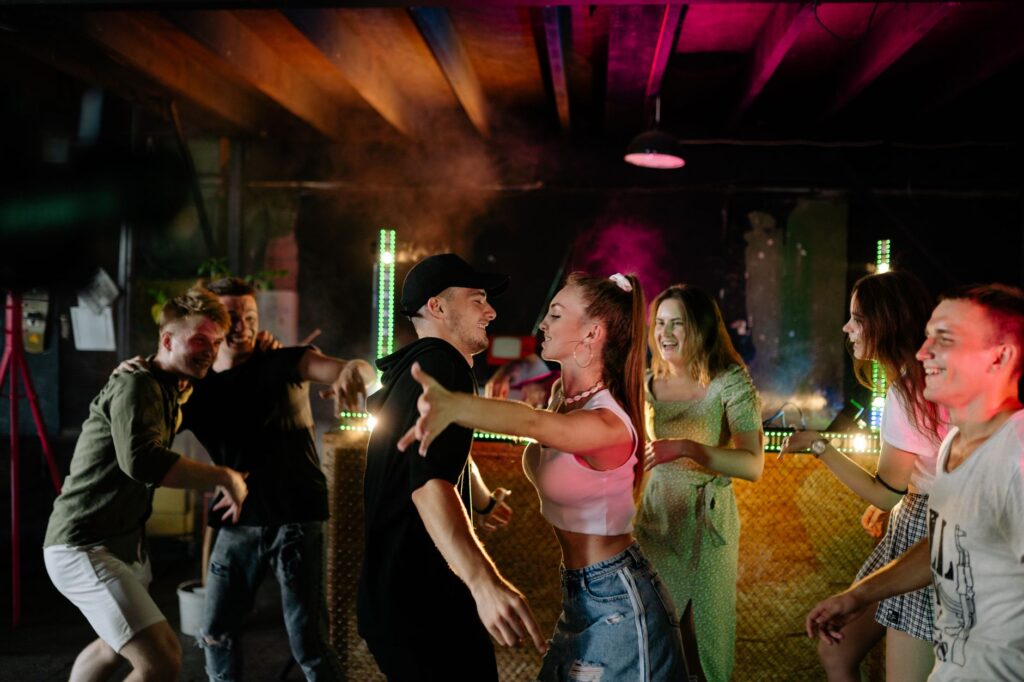 Group of friends celebrating at a Las Vegas nightclub, vibrant atmosphere with colorful lights. — bachelorette party in …
