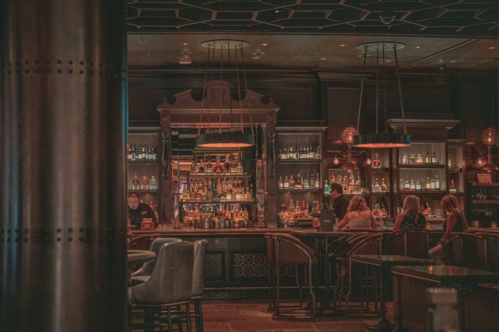 A bartender serving drinks at a Las Vegas casino bar — free drinks in Las Vegas casinos