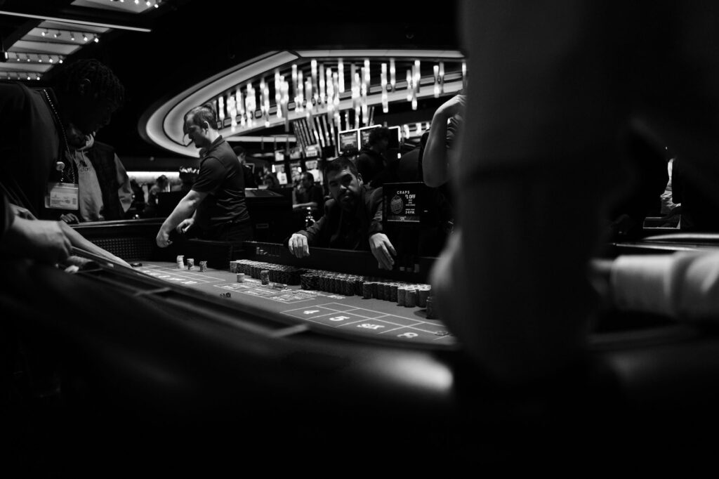 A bustling Las Vegas casino floor filled with players and servers — free drinks in Las Vegas casinos