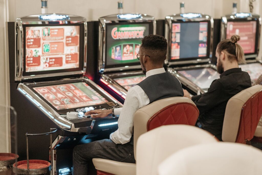 A bustling Las Vegas casino floor filled with players at tables and slot machines. — Las Vegas casino etiquette