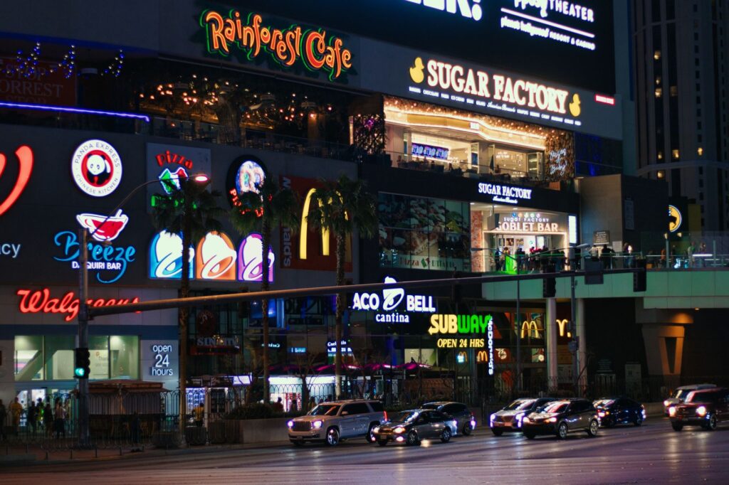 A bustling Las Vegas street filled with various dining options. — best restaurants in Las Vegas