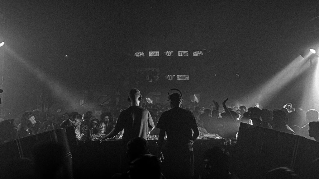 A bustling scene at one of the best clubs in Vegas with people dancing and enjoying the music. — Las Vegas nightlife gui…