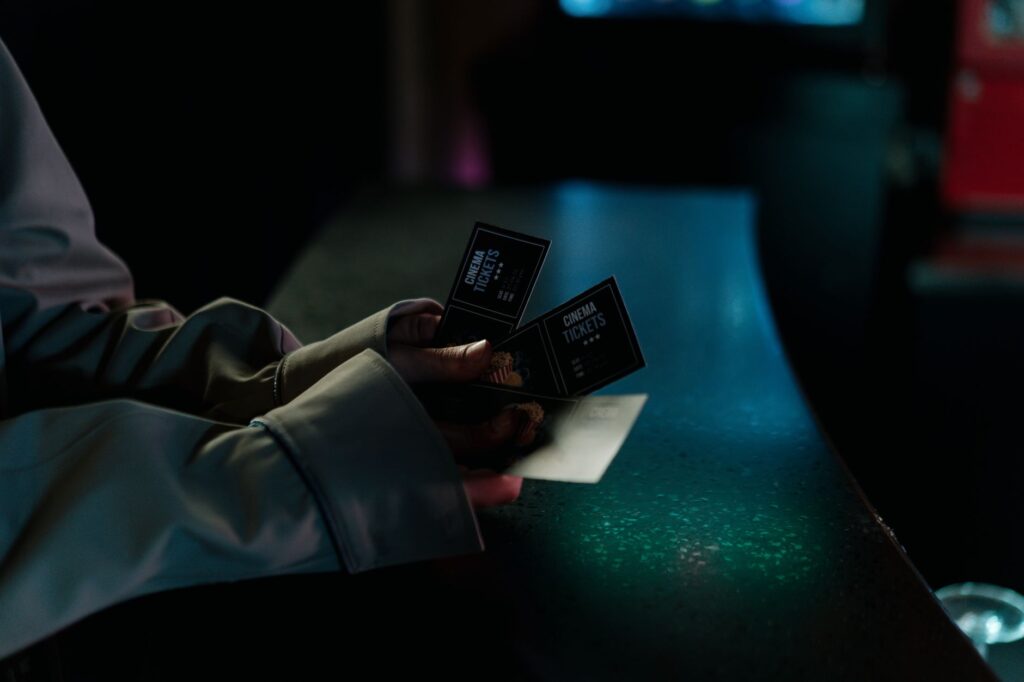 A close-up of a smartphone displaying a ticket purchasing app for cheap Vegas shows. — discount show tickets Las Vegas