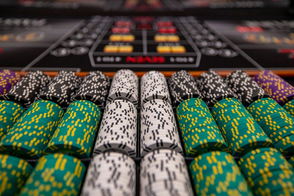 A close-up of a vibrant cocktail with casino chips in the background — free drinks in Las Vegas casinos