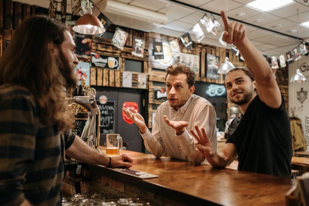 A cozy, affordable bar with patrons enjoying drinks during happy hour. — budget nightlife Las Vegas