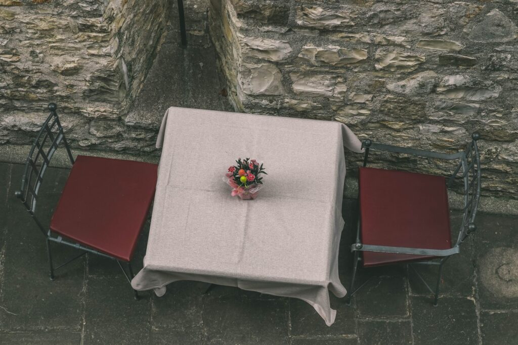 A cozy table set for two at a romantic restaurant in Las Vegas. — romantic getaway Las Vegas