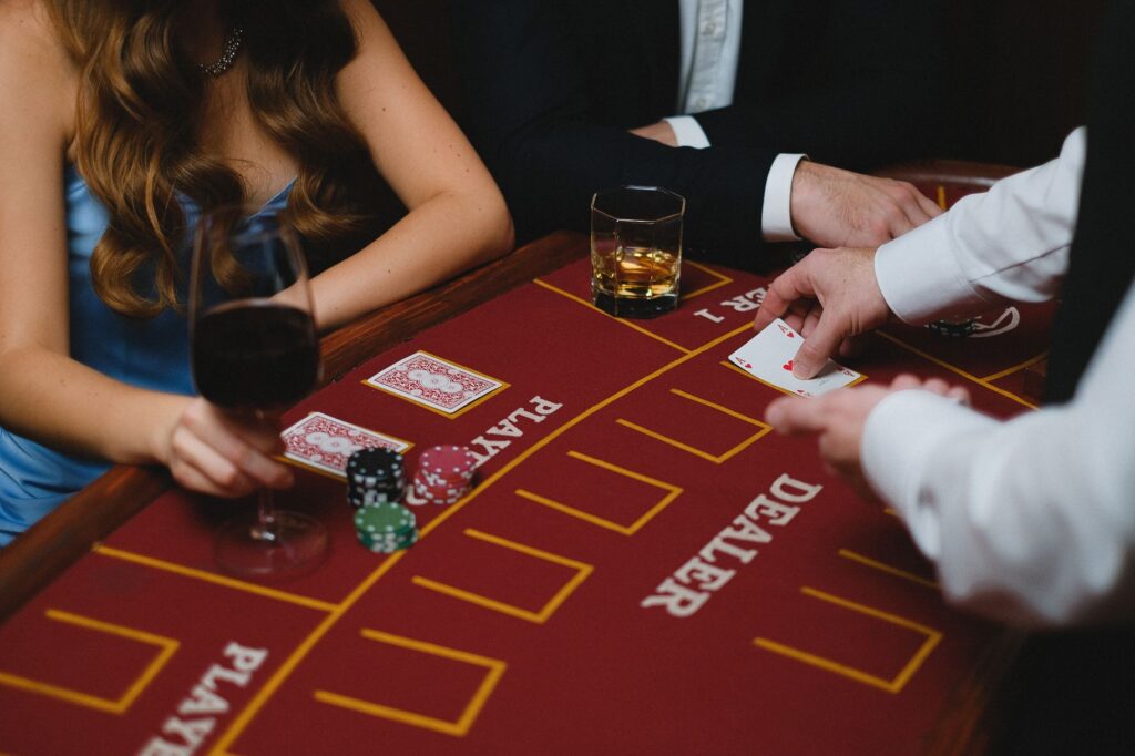 A dealer interacting with players at a blackjack table, showcasing proper etiquette. — Las Vegas casino etiquette