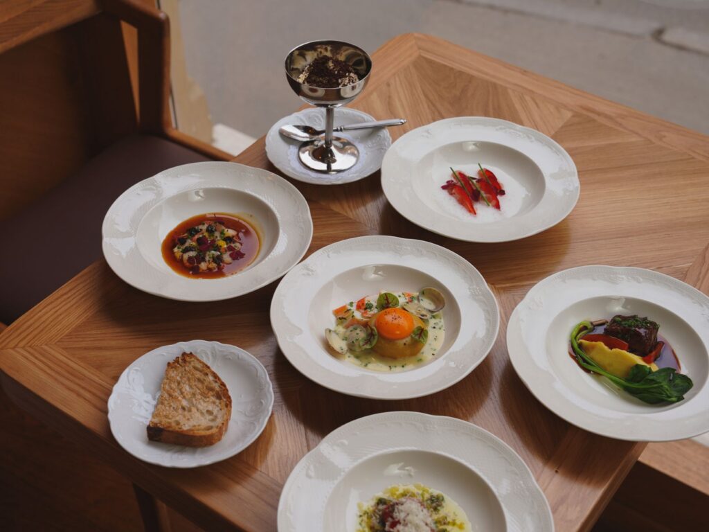 A food critic reviewing dishes at a top fine dining establishment. — Las Vegas dining