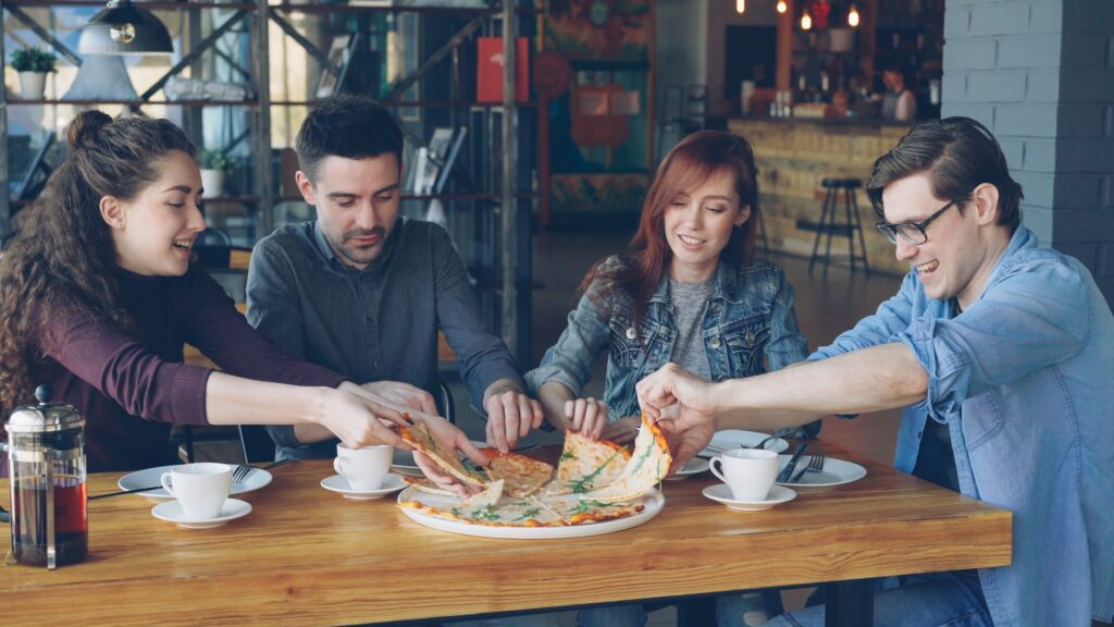 A group of friends enjoying a meal together at a cozy, affordable restaurant. — cheap eats Las Vegas