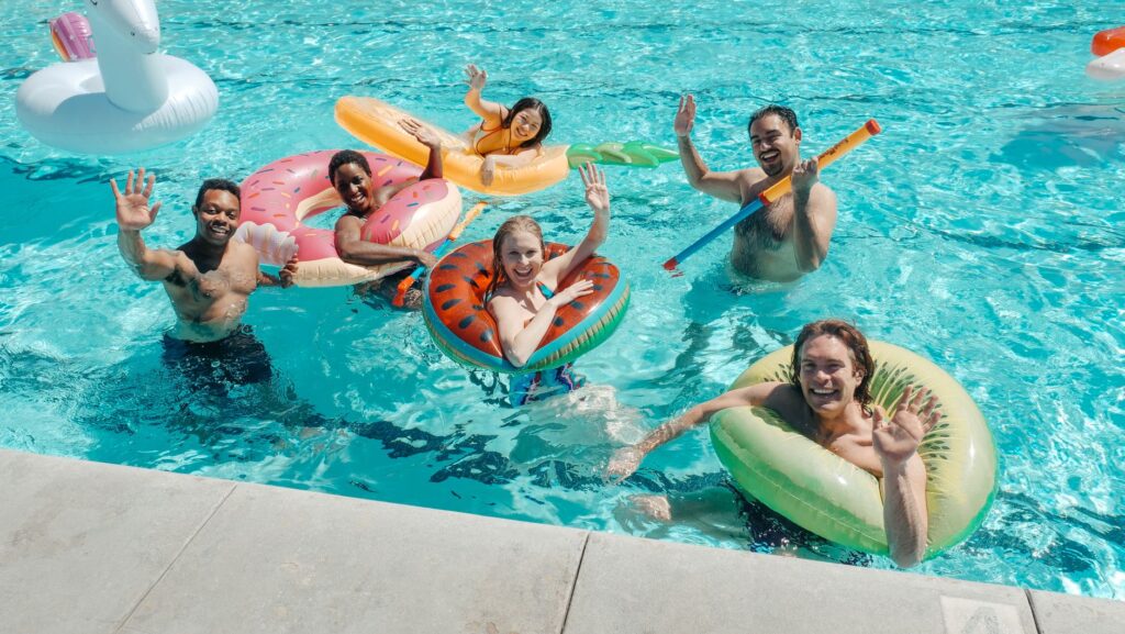A group of friends enjoying a pool party at a Las Vegas resort. — best time to visit Las Vegas