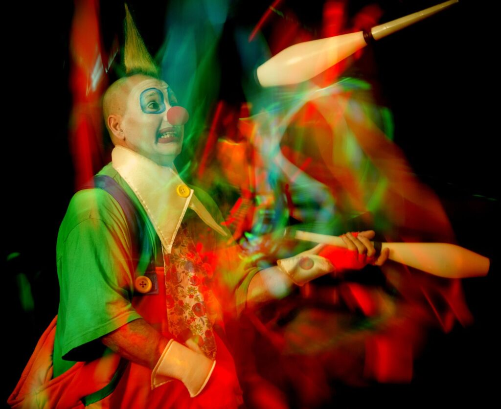 A lively scene from Absinthe featuring acrobats and a comedic performer. — Las Vegas shows 2026