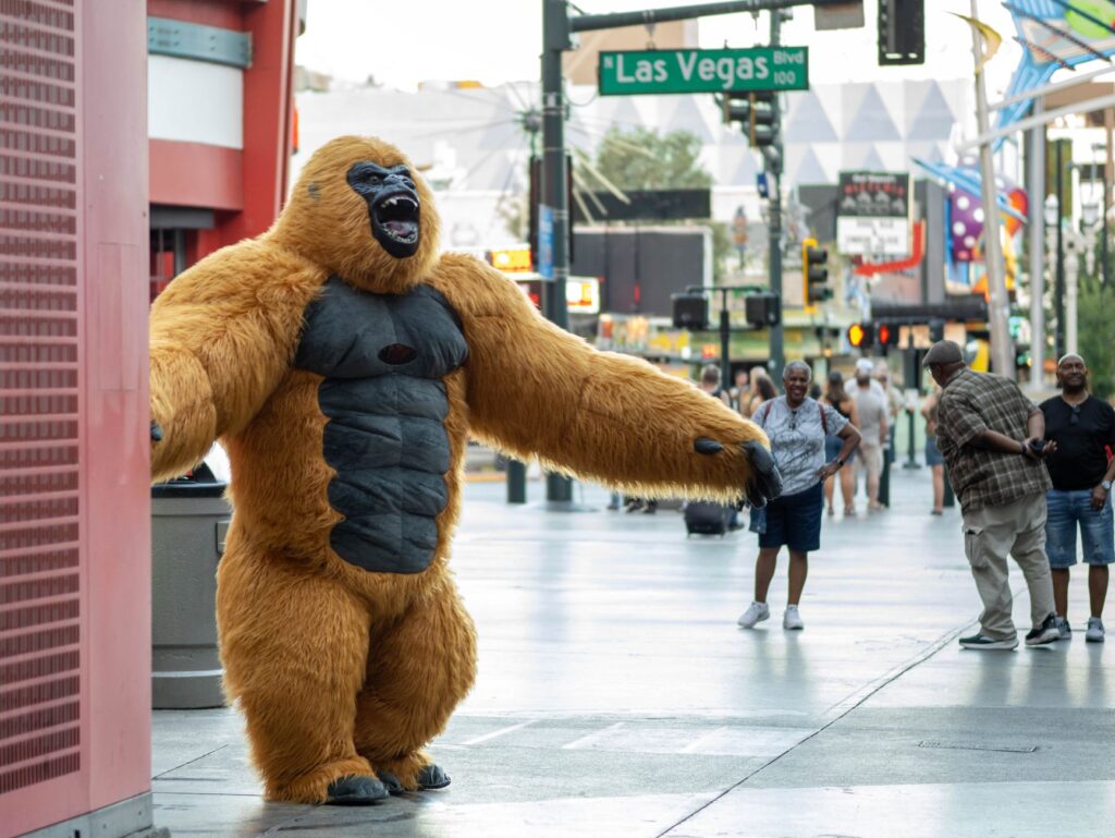 A lively street performer entertaining a crowd on the Las Vegas Strip. — free attractions in Las Vegas