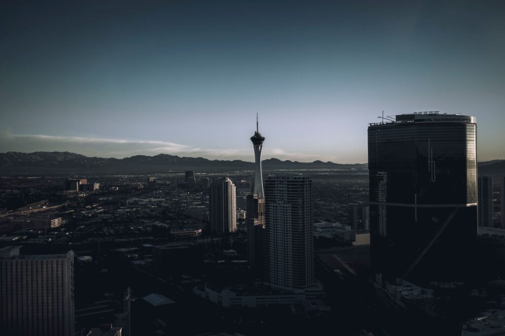A panoramic view of a rooftop bar in Las Vegas, showcasing the skyline at sunset. — best nightlife in Las Vegas