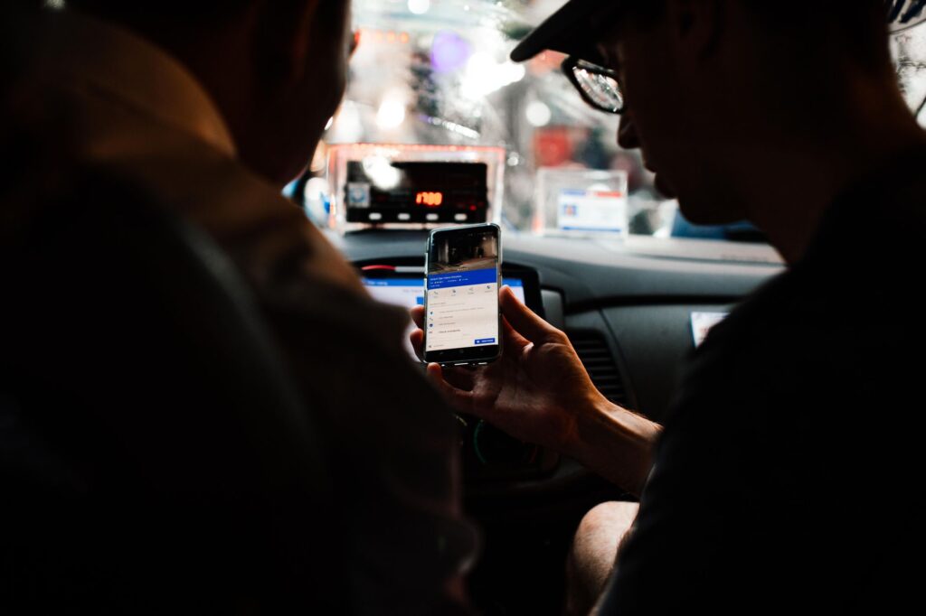 A rideshare vehicle picking up passengers outside a popular casino. — Las Vegas transportation guide
