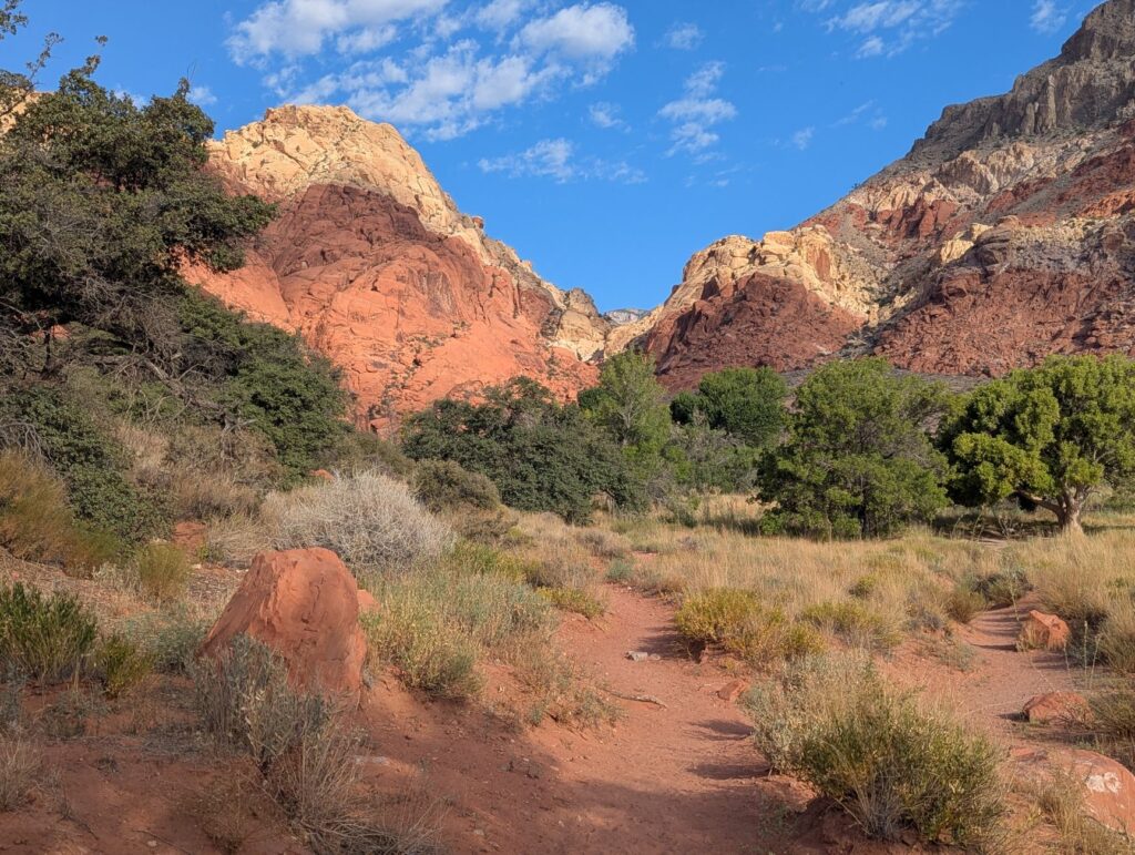 A scenic hiking trail surrounded by red rock formations, showcasing the natural beauty of Vegas. — hidden gems Las Vegas