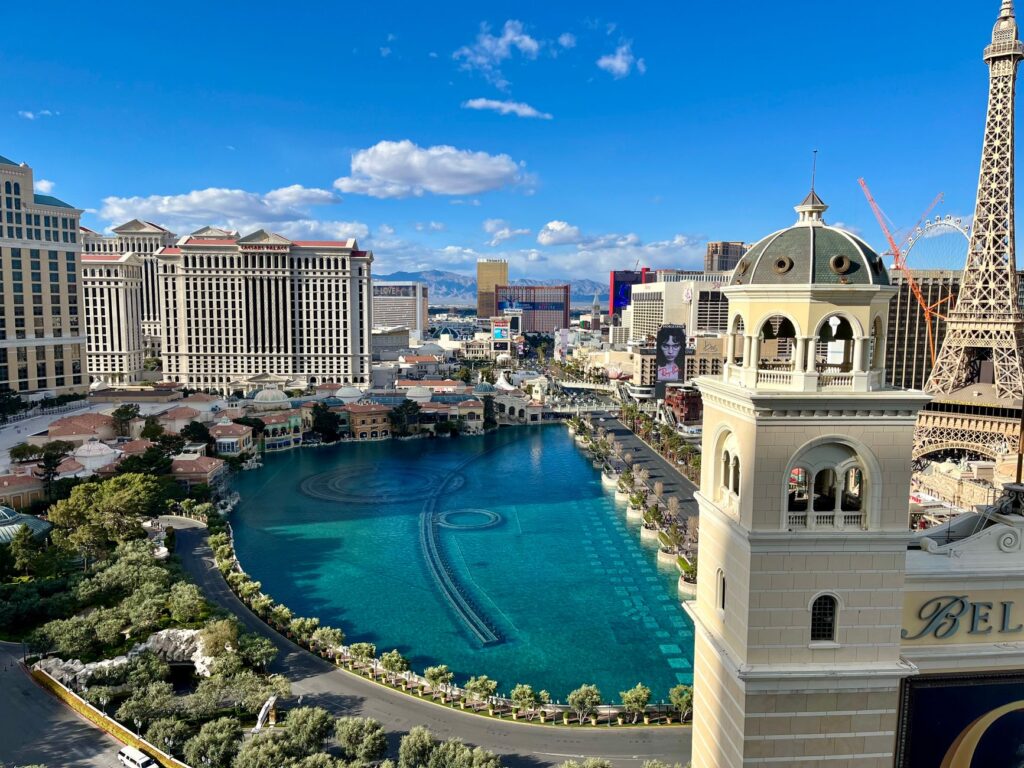 A scenic image of Las Vegas in summer with vibrant pool parties and festival scenes, showcasing why summer is the best time to visit Las Vegas.