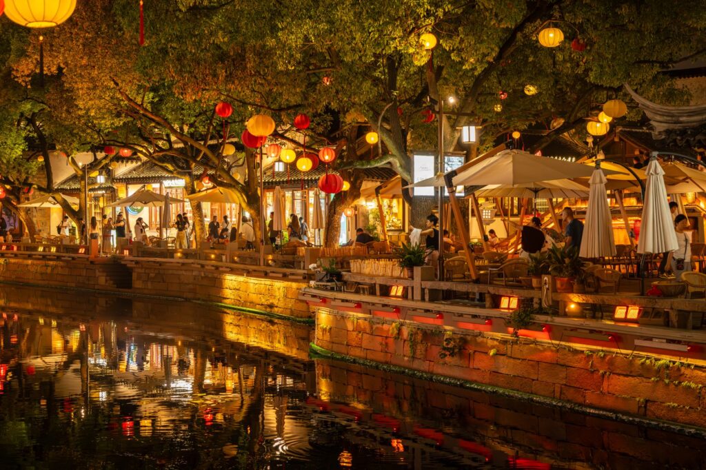 A scenic photo of a popular dining spot along the Strip, with people dining outdoors. — Las Vegas Strip walking guide