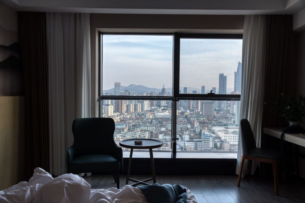A snapshot of a hotel room with a view of the Strip, illustrating potential travel deals and accommodations. — best time…