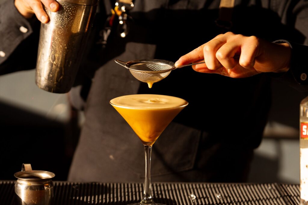 A stylish bar featuring signature cocktails and a lively atmosphere. — Vegas nightlife