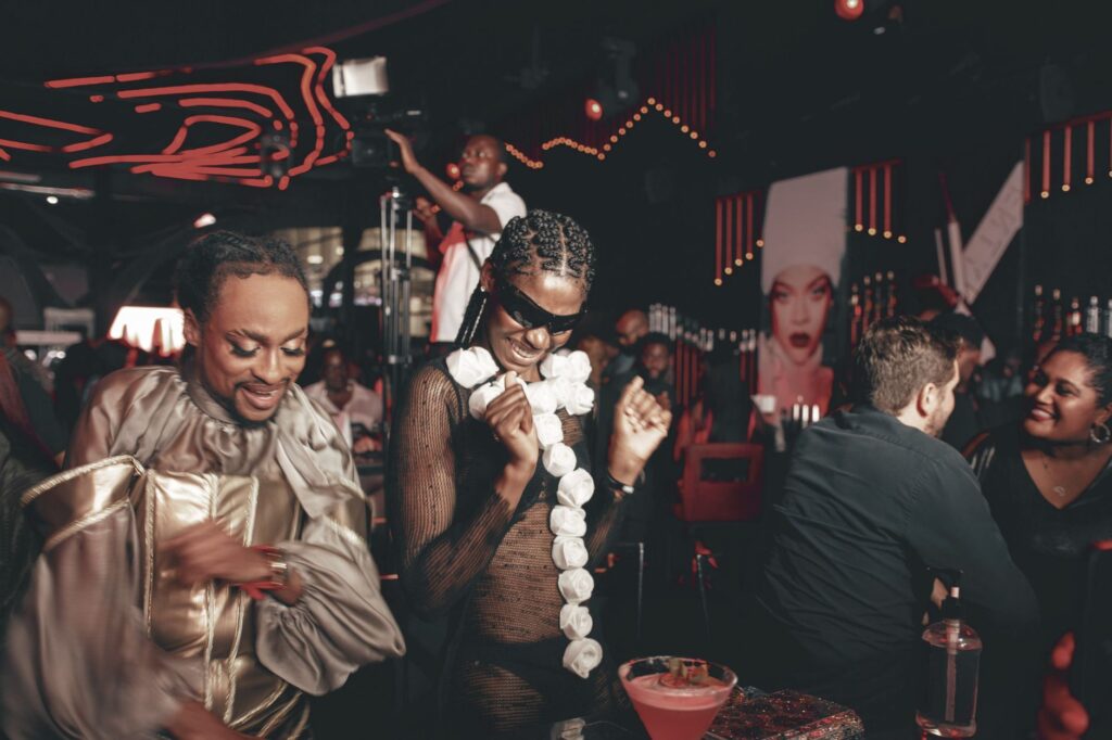 A stylishly dressed group of people outside a club enjoying a night out in budget nightlife Las Vegas.