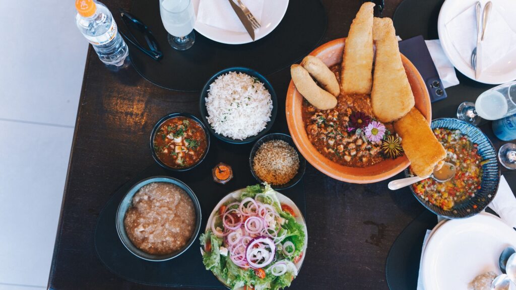 A table set with a variety of affordable dishes from different cuisines in Las Vegas. — affordable dining Las Vegas