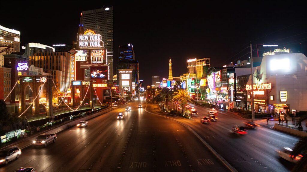 A vibrant Las Vegas Strip scene at night showcasing the nightlife atmosphere. — Vegas nightlife budget tips