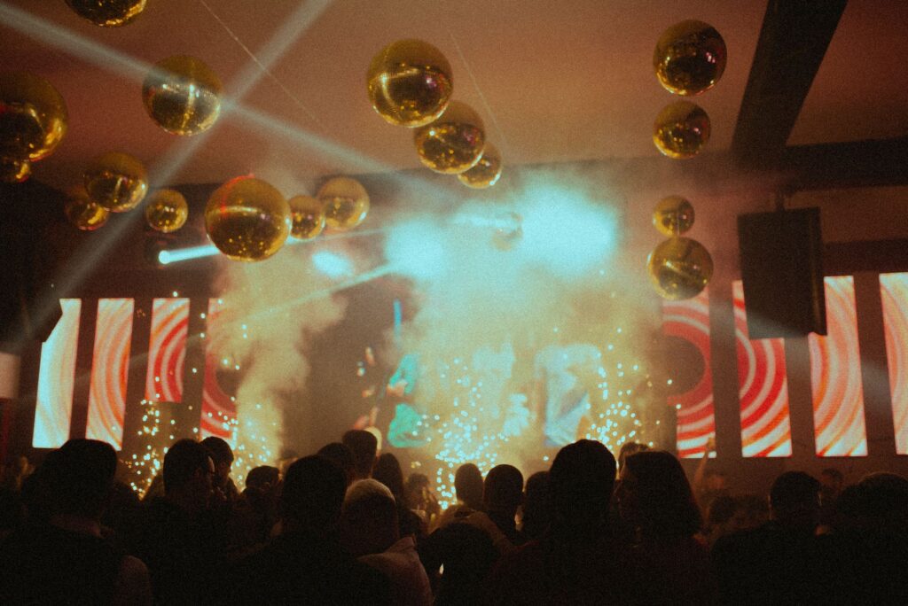 A vibrant club scene in Las Vegas with colorful lights and a packed dance floor. — Las Vegas nightlife bars clubs