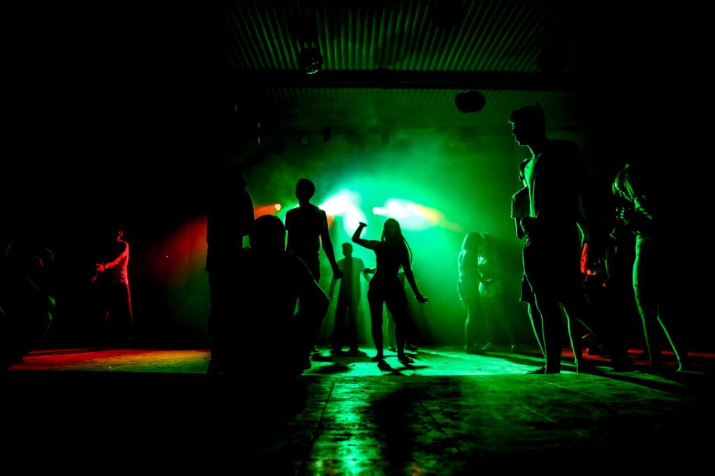 A vibrant club scene in Las Vegas with colorful lights and dancing patrons — Las Vegas nightlife guide