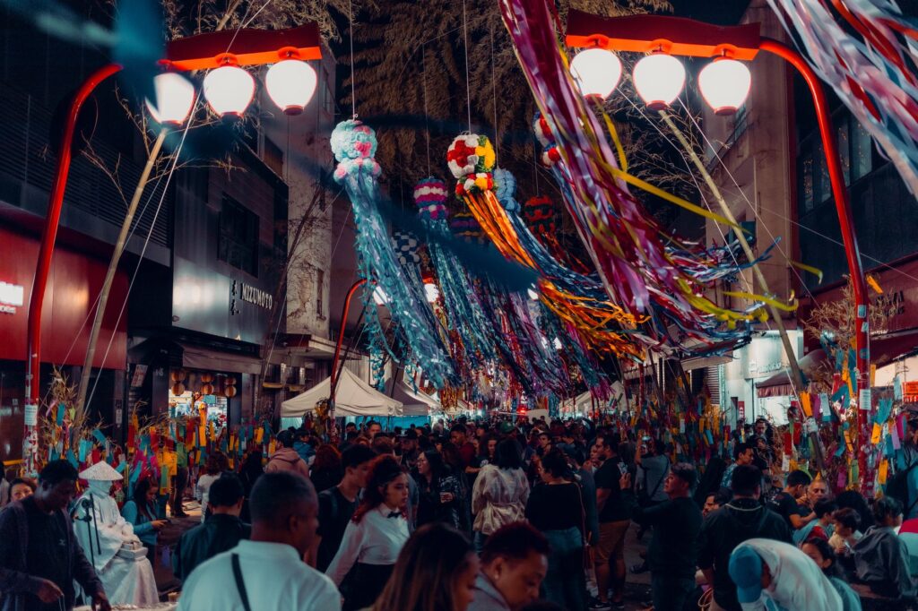 A vibrant street scene during a Las Vegas festival, showcasing crowds and decorations. — best times to visit Las Vegas