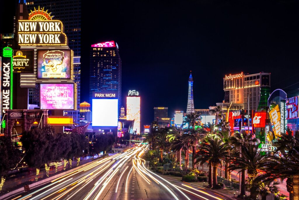 A vibrant view of the Las Vegas Strip at night, showcasing its iconic lights, perfect for the Las Vegas Strip walking guide.