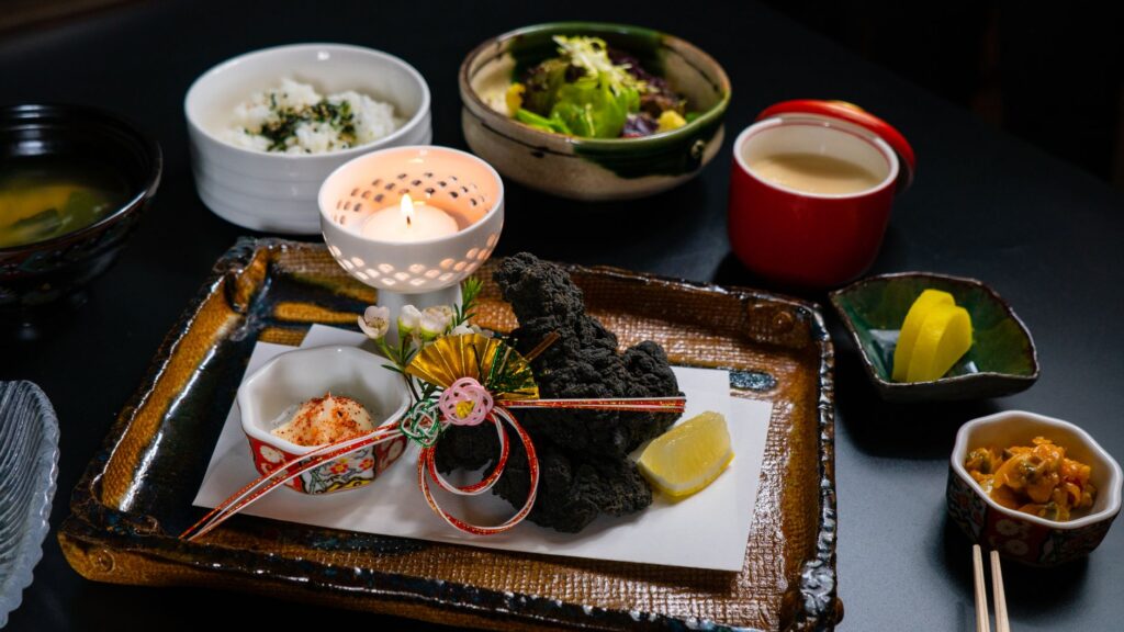 An array of international dishes beautifully presented on a table, representing a global dining experience. — unique din…