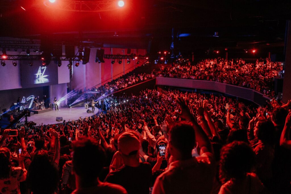 An enthusiastic audience enjoying a live performance in a Las Vegas theater. — discount show tickets Las Vegas
