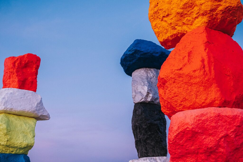 An outdoor shot of the Seven Magic Mountains, with colorful rock formations against the desert backdrop. — free activiti…