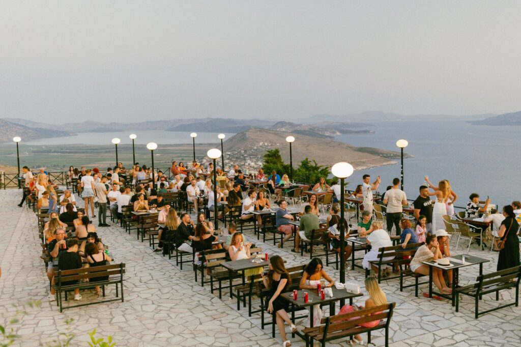 People enjoying drinks at Skyfall Lounge with a panoramic backdrop — rooftop bars in Las Vegas