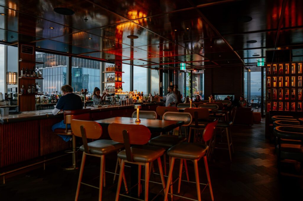 The vibrant ambiance of The Chandelier rooftop bar filled with patrons — rooftop bars in Las Vegas