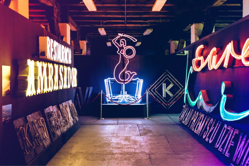 Visitors enjoying the vibrant art installations at the Neon Museum. — non-casino attractions Las Vegas