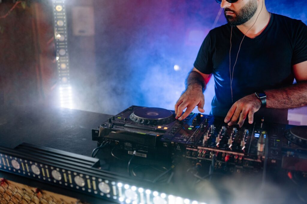 A DJ performing at a Las Vegas club with colorful lights — Las Vegas nightclubs guide