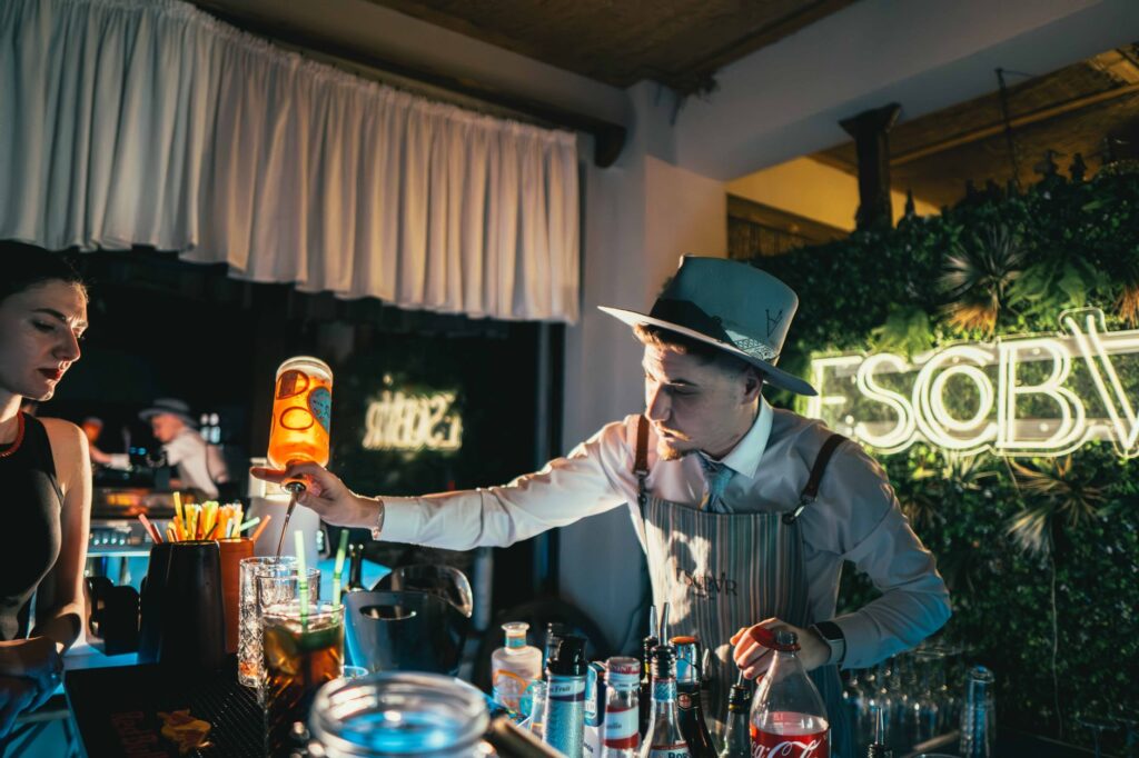 A bustling bar scene with colorful cocktails being served to patrons — Las Vegas nightlife