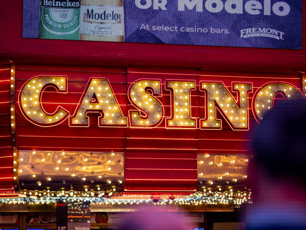 A busy Las Vegas street at night, illuminated by neon lights and showcasing nightlife activity — Las Vegas nightlife