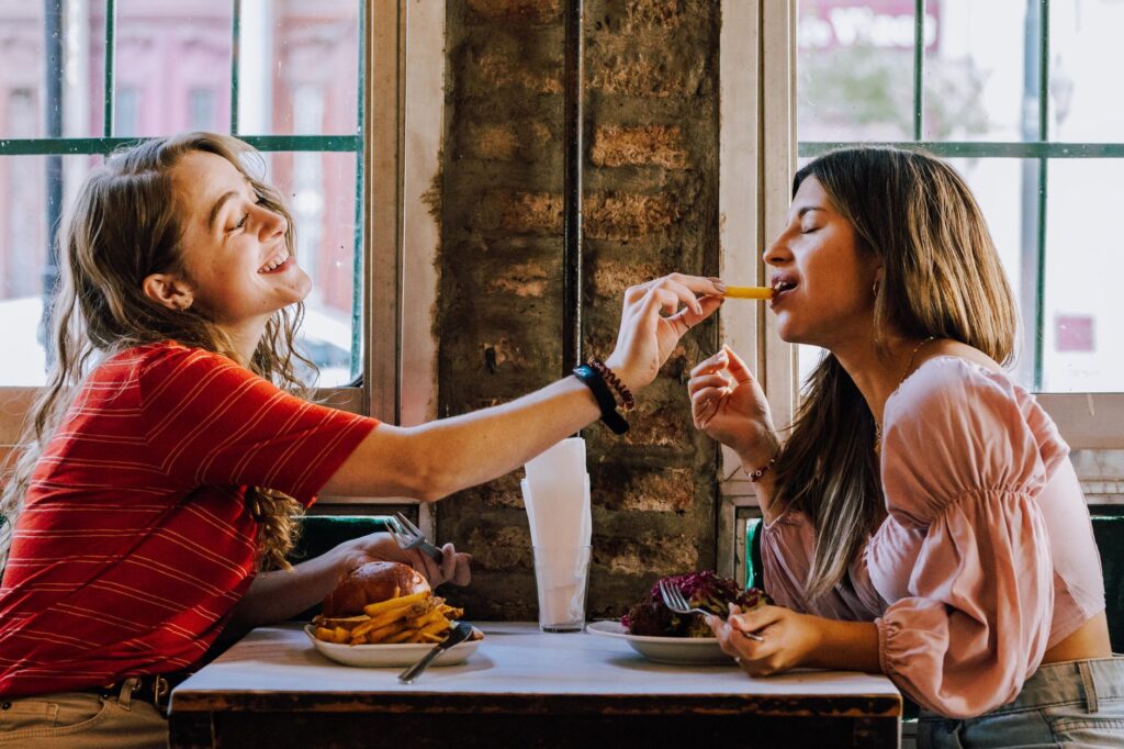 A cozy interior of a popular budget restaurant in Las Vegas filled with happy diners enjoying their meals. — affordable …