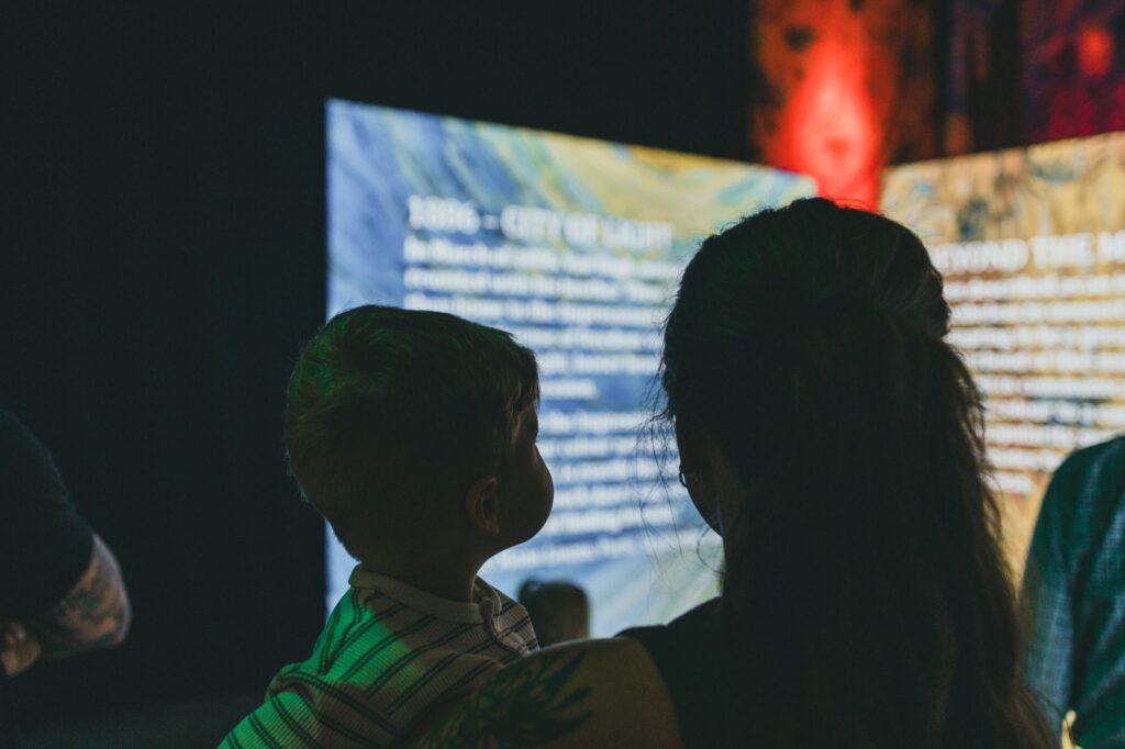 A family exploring an interactive exhibit at a Las Vegas museum. — family activities in Las Vegas