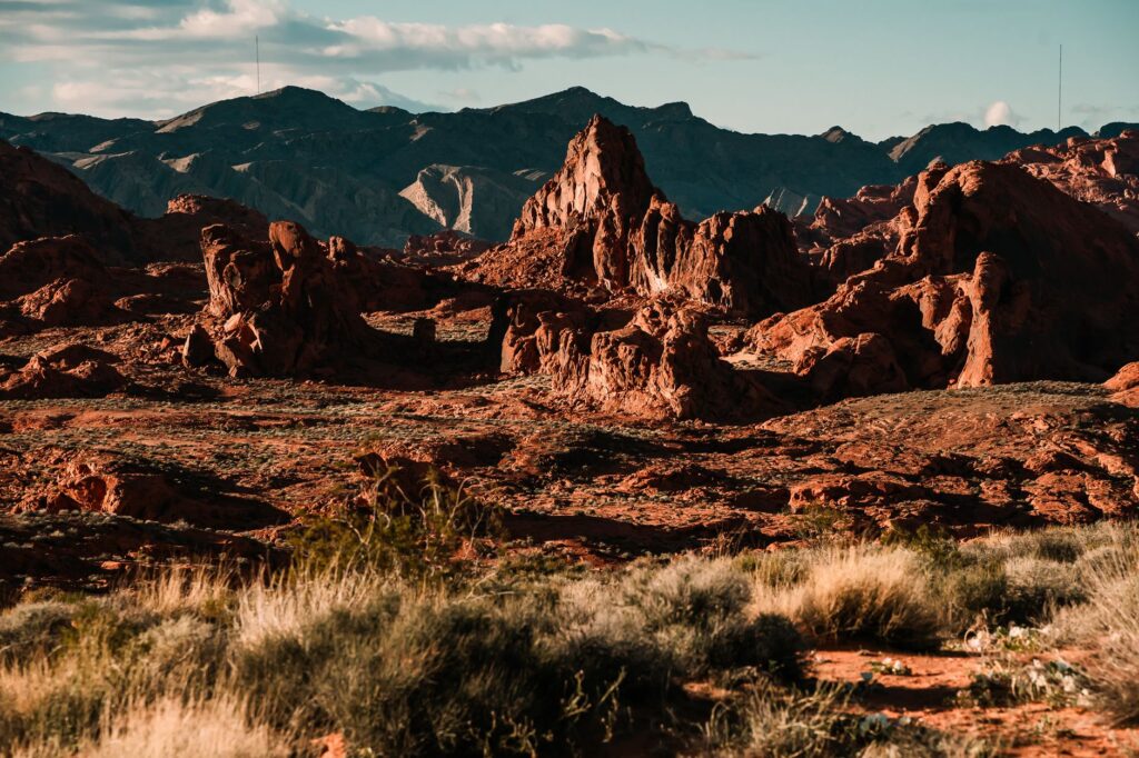A vibrant sunset over Valley of Fire State Park highlighting its unique rock formations. — Las Vegas day trips