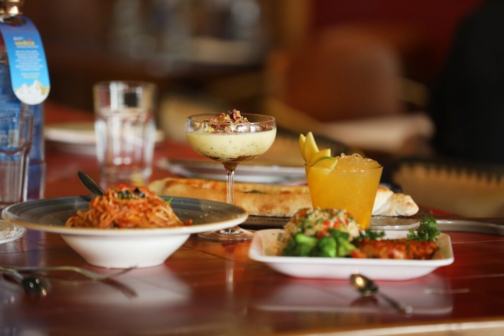 A vibrant table setting at one of the best restaurants in Las Vegas, showcasing gourmet dishes.