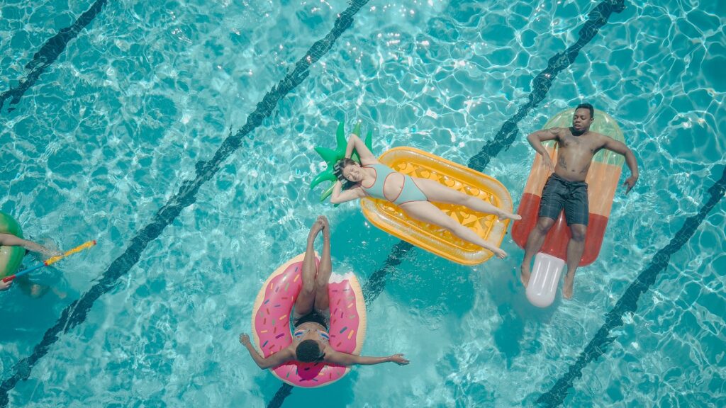 An aerial shot of a summer pool party in Las Vegas, filled with people enjoying the sun. — best time to visit Las Vegas